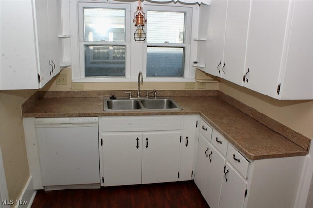 kitchen with dishwasher, sink, and white cabinets