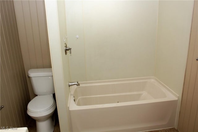 bathroom with a bathtub and toilet