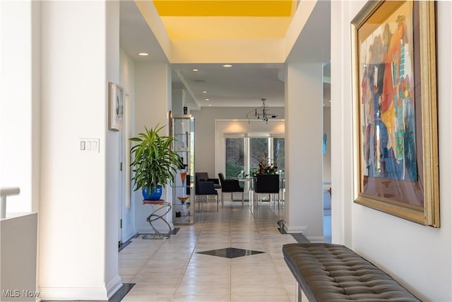 hall featuring light tile patterned flooring