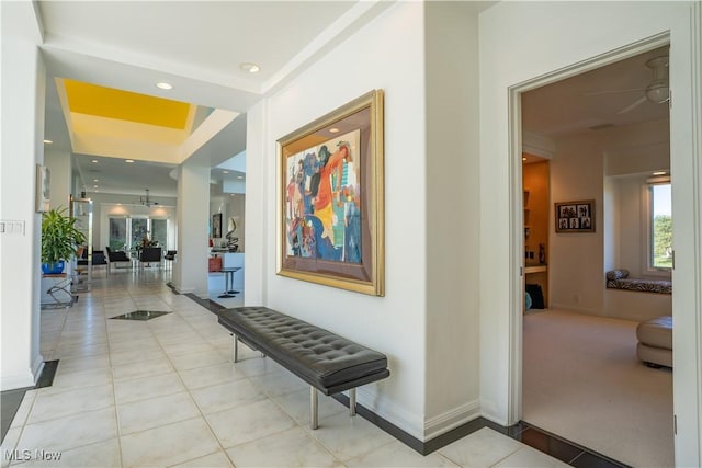 corridor featuring light tile patterned flooring