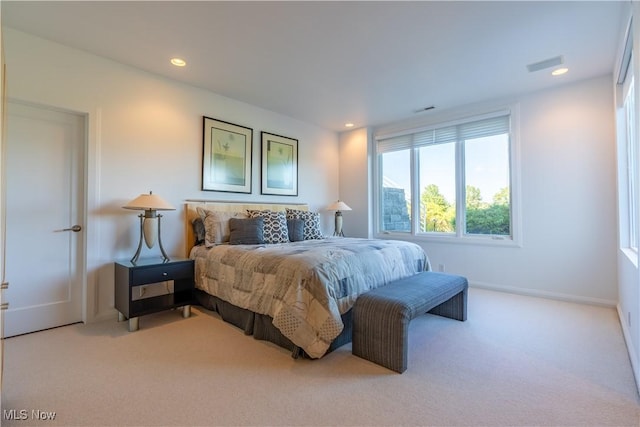 bedroom with light colored carpet