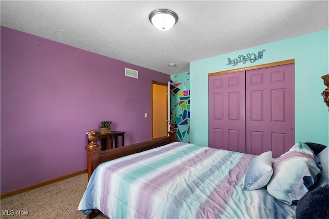 carpeted bedroom with a closet