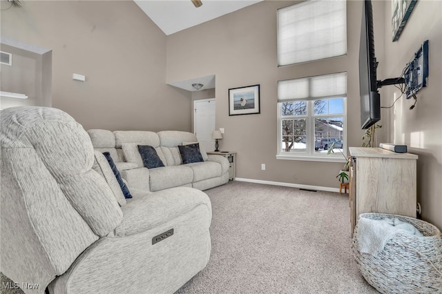 carpeted living room with lofted ceiling