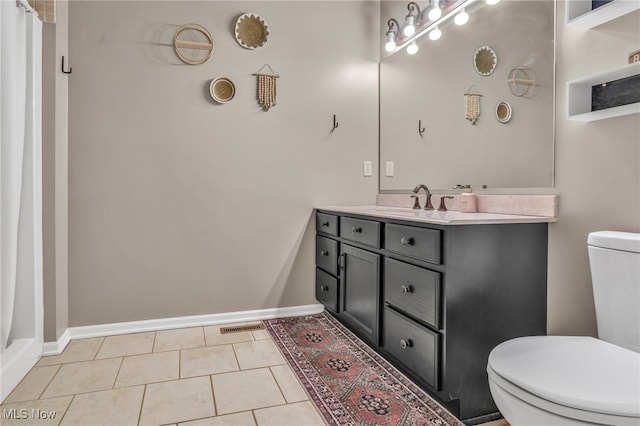 bathroom with vanity, tile patterned floors, toilet, and a shower with shower curtain