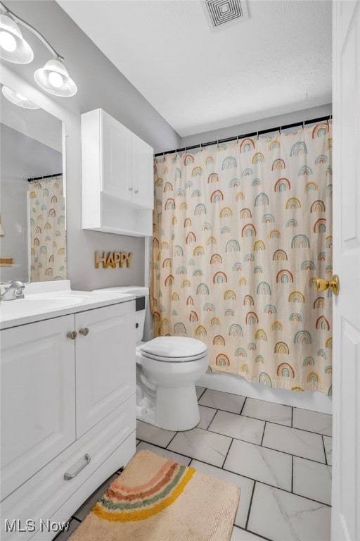 full bathroom with tile patterned flooring, vanity, shower / bath combination with curtain, and toilet