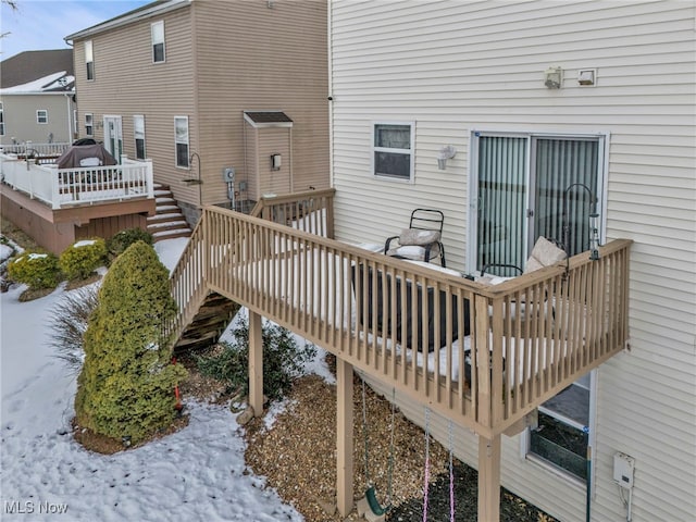 view of snow covered deck