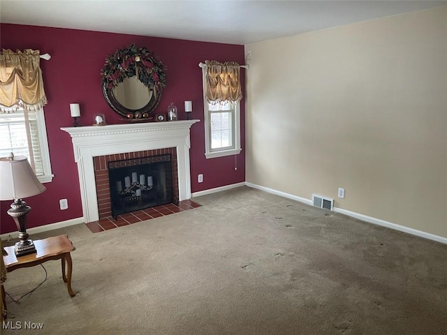 carpeted living room featuring a brick fireplace