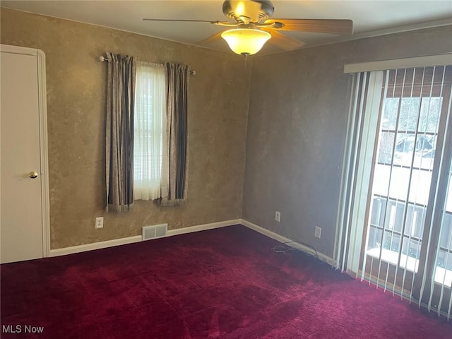 empty room with carpet and ceiling fan