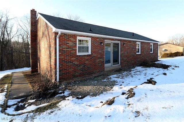 view of snow covered house