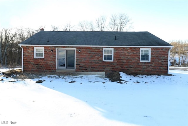 view of snow covered house