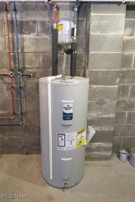 utility room featuring electric water heater