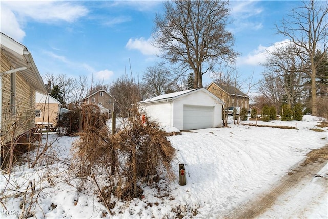 exterior space with an outbuilding and a garage