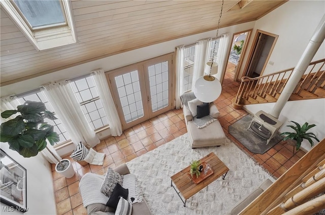 7750 W Calla Rd, Canfield, OH 44406 - living area featuring light tile patterned floors, wood ceiling, french doors, lofted ceiling with skylight, and stairs
