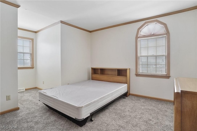 carpeted bedroom with crown molding