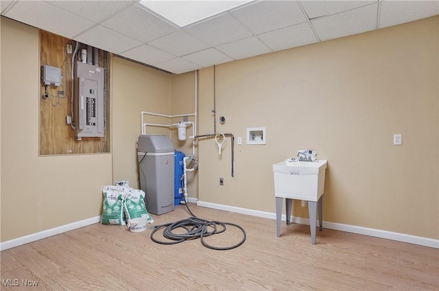 laundry area with hardwood / wood-style flooring, washer hookup, and electric panel