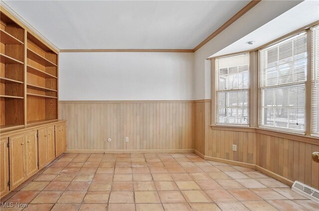7750 W Calla Rd, Canfield, OH 44406 - empty room featuring crown molding, wainscoting, baseboards, and wooden walls