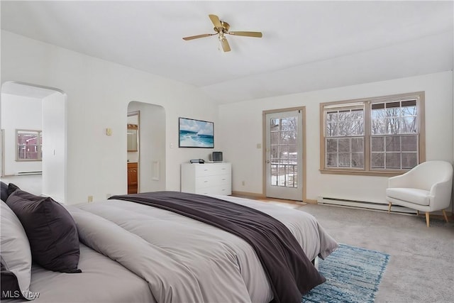 carpeted bedroom featuring ensuite bathroom, lofted ceiling, a baseboard heating unit, access to exterior, and ceiling fan