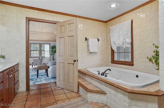 7750 W Calla Rd, Canfield, OH 44406 - ensuite bathroom with tile patterned floors, crown molding, tile walls, and a bath