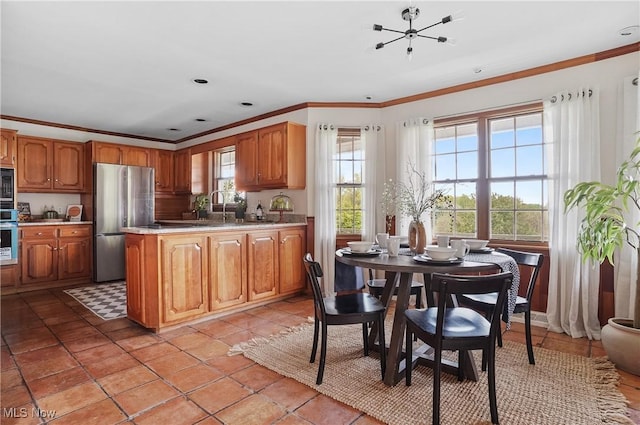 7750 W Calla Rd, Canfield, OH 44406 - kitchen featuring an inviting chandelier, light countertops, stainless steel appliances, and crown molding