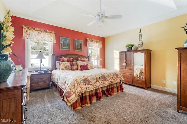 bedroom featuring ceiling fan and carpet