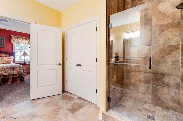 bathroom featuring a shower with shower door