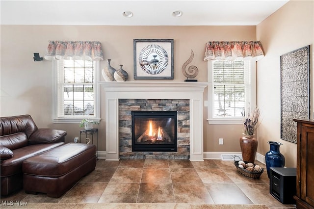 sitting room featuring plenty of natural light and a fireplace