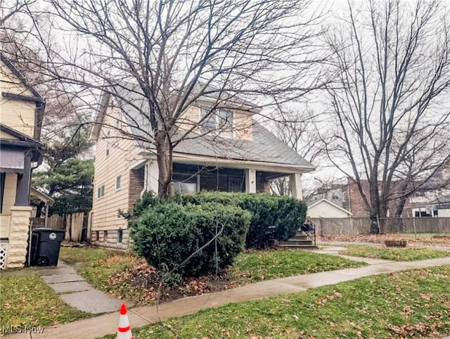 3235 W 94th St, Cleveland, OH 44102 - bungalow-style house featuring a front yard