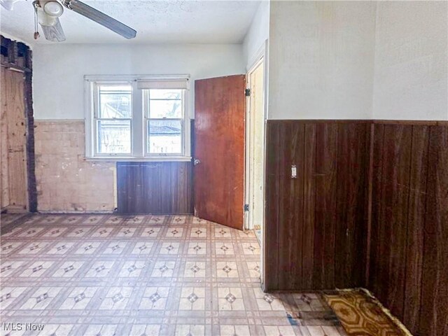 3235 W 94th St, Cleveland, OH 44102 - spare room with ceiling fan and a textured ceiling