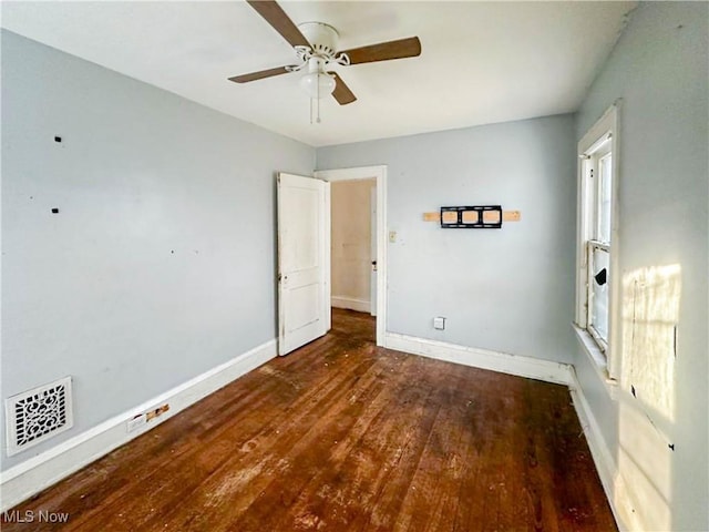 3235 W 94th St, Cleveland, OH 44102 - empty room with dark wood-type flooring and ceiling fan