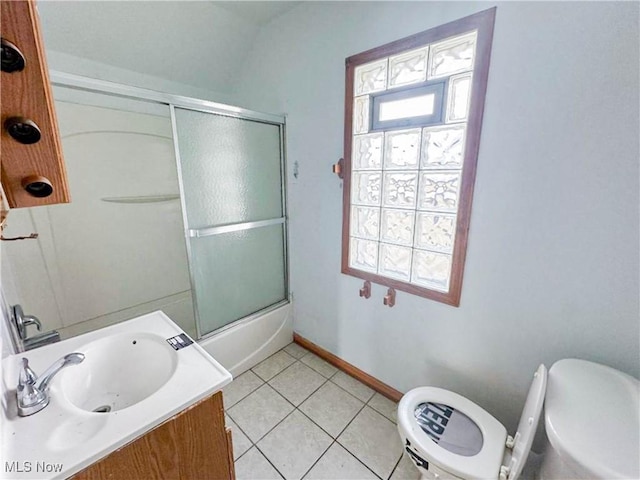 3235 W 94th St, Cleveland, OH 44102 - full bathroom with toilet, vanity, shower / bath combination with glass door, and tile patterned flooring