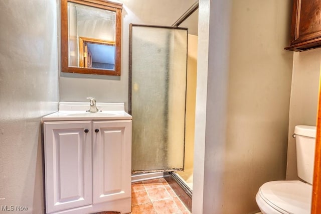 bathroom featuring a shower, vanity, and toilet