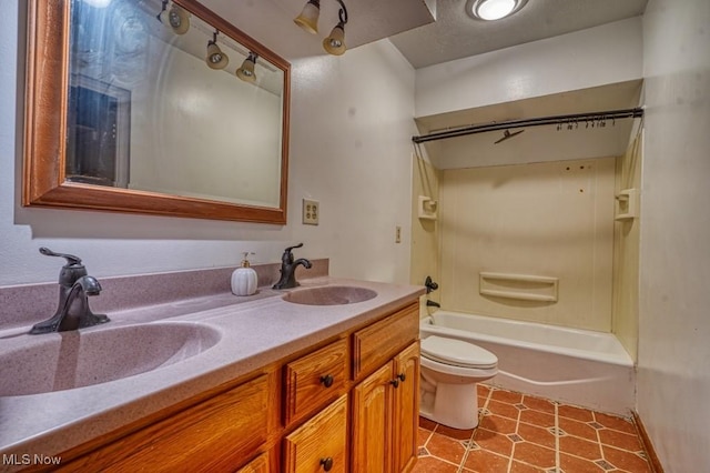 full bathroom with tile patterned floors, vanity, toilet, and shower / tub combination