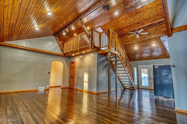 unfurnished living room with rail lighting, ceiling fan, hardwood / wood-style floors, high vaulted ceiling, and wooden ceiling