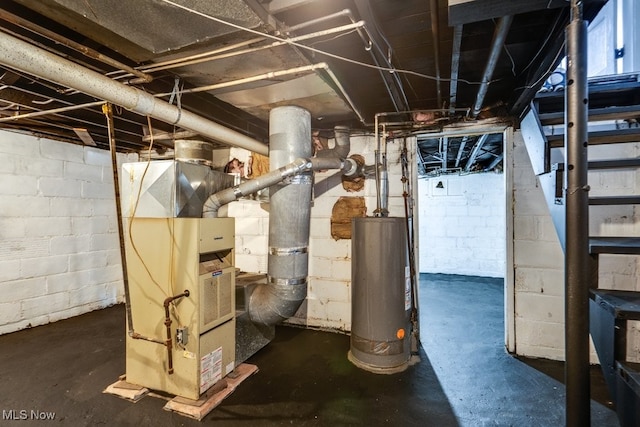 utility room with heating unit and water heater