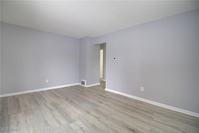 empty room with light wood-type flooring