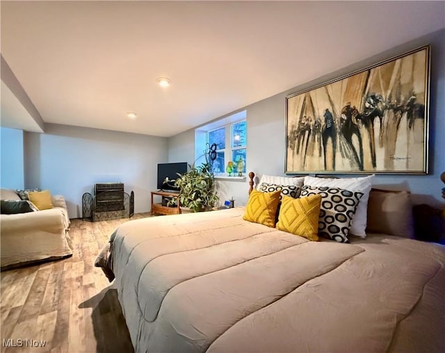 bedroom with wood finished floors