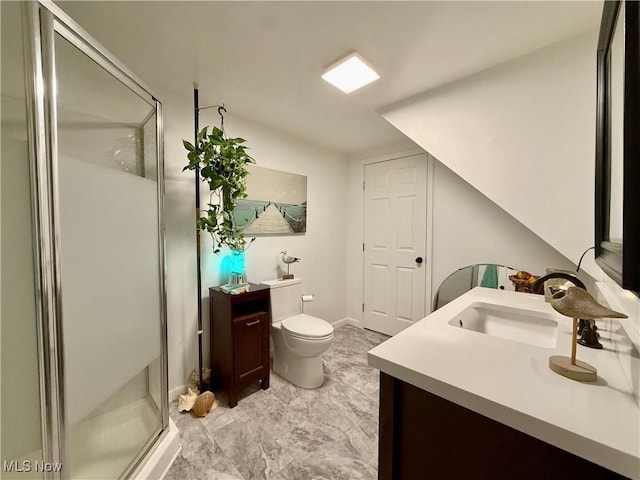 full bath featuring a shower stall, vanity, and toilet