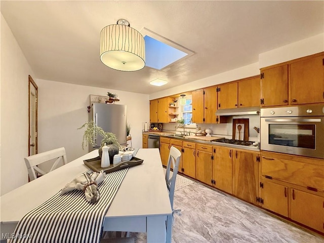 dining room with a skylight