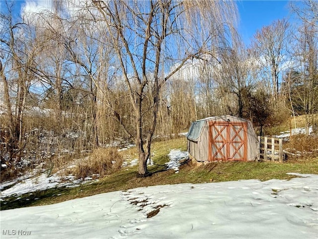 exterior space featuring an outbuilding and a storage shed