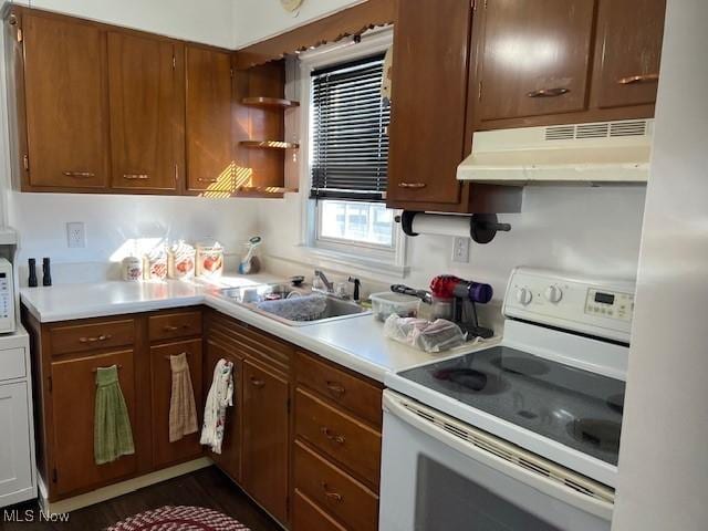 kitchen featuring white appliances and sink