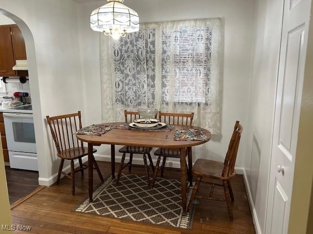 dining space featuring dark hardwood / wood-style flooring