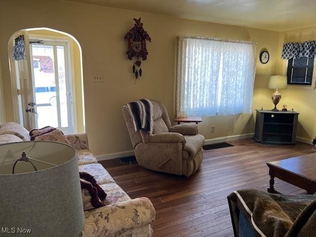 living room with dark hardwood / wood-style floors