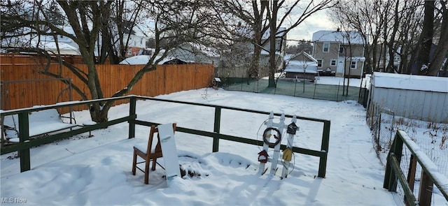 view of yard layered in snow