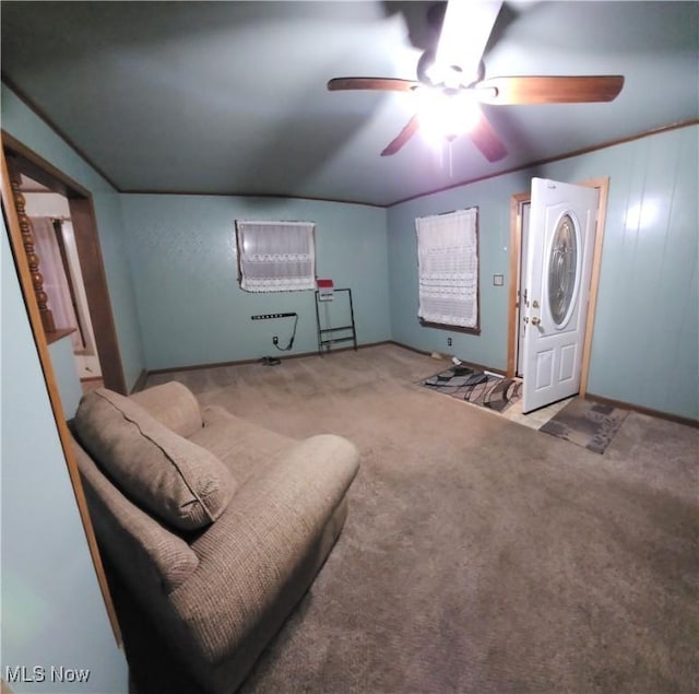 carpeted living room featuring ceiling fan