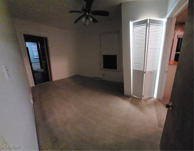 unfurnished room featuring ceiling fan