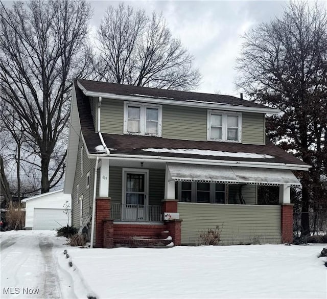 view of front of property featuring an outbuilding and a garage