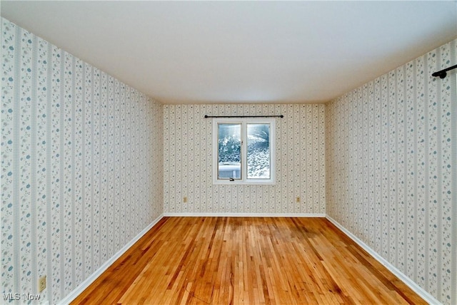 empty room with wood-type flooring