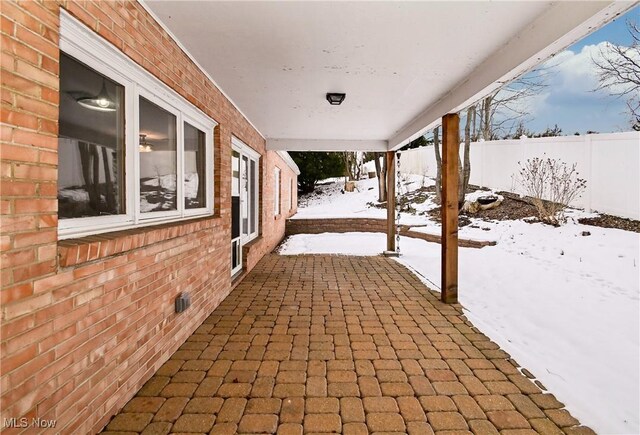 view of snow covered deck