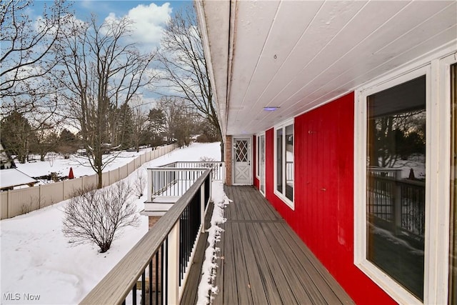 view of snow covered deck