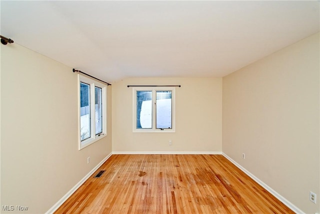 empty room featuring hardwood / wood-style floors